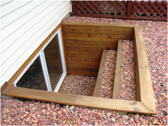 In Bracebridge, Gravenhurst and Muskoka egress window wells can be made of many materials such as this timber framed one with steps.